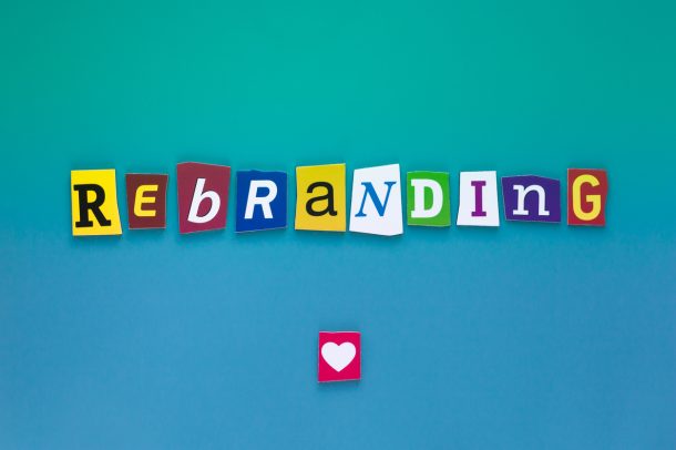 Inscription Rebranding. A word writing text showing concept of Rebranding made of different magazine newspaper letter for Business case on a blue background.